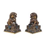 A pair of Chinese gilt-bronze Buddhist lions, with cloisonné bases, overall height 20cm and the