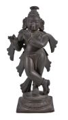 A bronze figure of Krishna playing the flute, Southern India, 19th century, the youthful deity