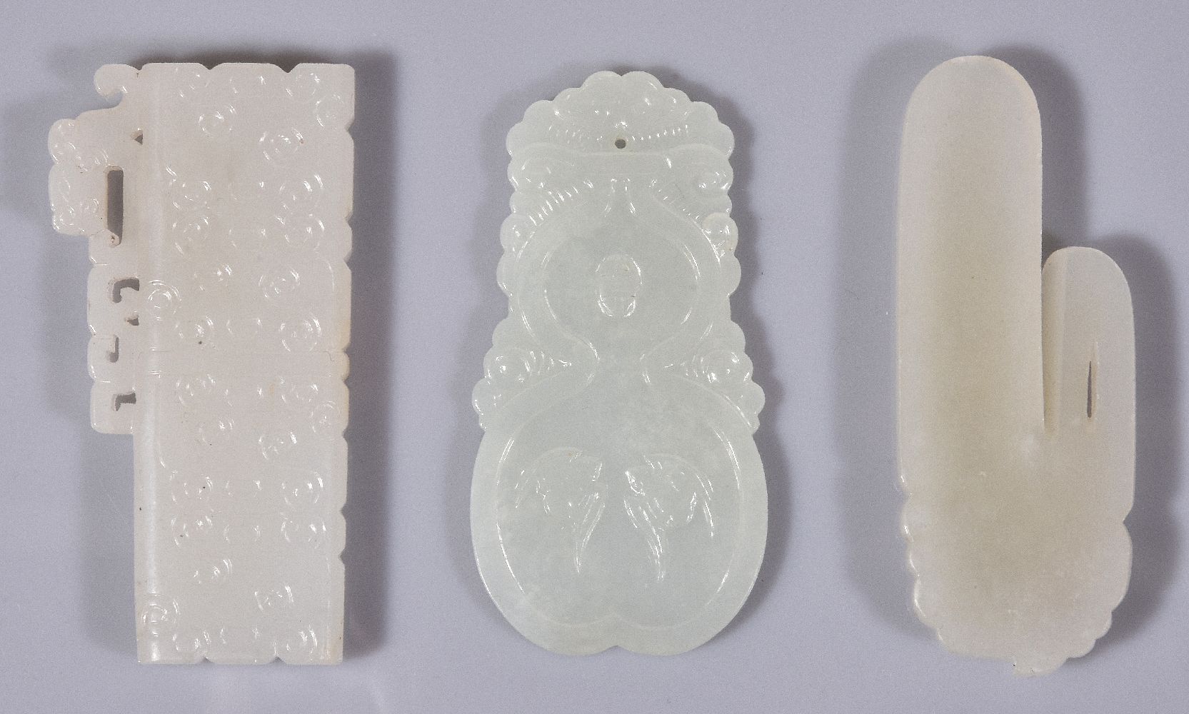 Three Chinese white jade archaistic carvings, the pale even stones with some mottled white - Image 2 of 5