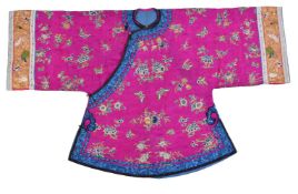 A Chinese embroidered magenta satin woman's side opening informal jacket, Qing Dynasty, late 19th