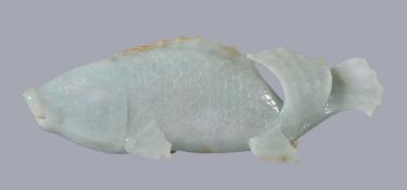 A Chinese jadeite celadon carving of a fish, late Qing Dynasty or Republican, probably a carp,