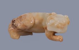 A Chinese white and brown jade carving of a 'Mythical Beast', Qing Dynasty, 18th -19th century,