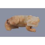 A Chinese white and brown jade carving of a 'Mythical Beast', Qing Dynasty, 18th -19th century,