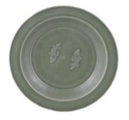 A Chinese Longquan celadon 'Twin Fish' dish, Southern Song Dynasty, the interior moulded with a pair