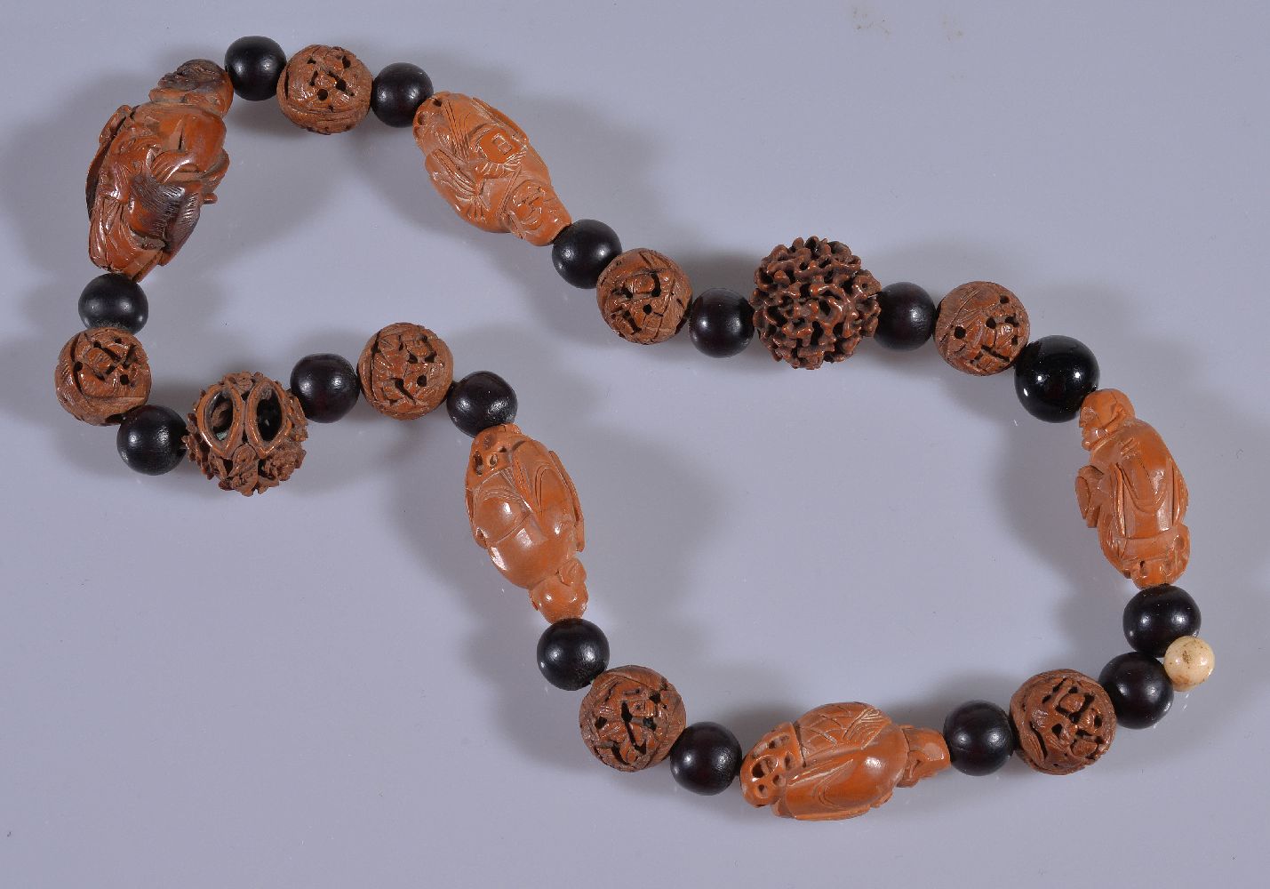 A Chinese carved nut bead necklace and bracelet, with variously carved and plain beads (2) 核雕项链及手串 - Image 2 of 3