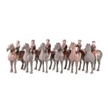 Six Chinese painted grey pottery Equestrian groups, Han Dynasty, standing four square with heads