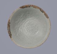 A Chinese 'Qingbai' bowl, Southern Song Dynasty, moulded with a double fish roundel in the centre of