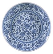 A Chinese blue and white 'Floral Scroll' Dish, Qing Dynasty, Yongzheng, in Ming-style, sturdily-