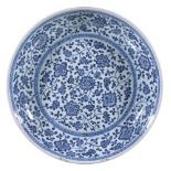 A Chinese blue and white 'Floral Scroll' Dish, Qing Dynasty, Yongzheng, in Ming-style, sturdily-