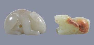 A Chinese celadon and russet jade horse, with incised main and tail, 4.3cm long x 2.3cm high x 1.6cm