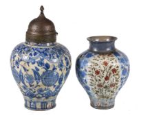 Two Safavid inverted baluster vases, Persia, 17th century, underglaze painted fritware, the larger