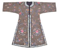 A Chinese olive green silk damask informal jacket, early 20th century, embroidered with flowers,