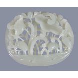 A Chinese white or pale celadon oval 'crane and lotus' plaque, worked with a tubular border