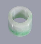 A Chinese jadeite archer's ring, probably Qing Dynasty, of cylindrical form with a bevelled edge,