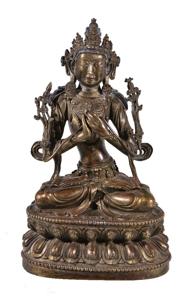 A Sino-Tibetan gilt- bronze figure of Manjusri, Qing Dynasty, China, 19th century, seated on a