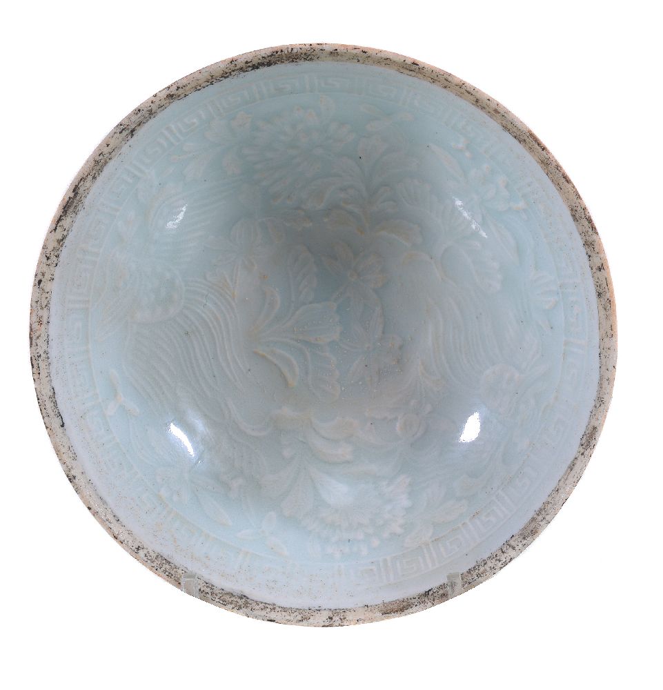 A Chinese moulded Qingbai ‘phoenix’ bowl, Song dynasty, moulded to the interior with a pair of