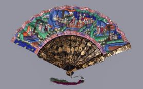 Y A Chinese lacquer and paper folding 'Mandarin' fan