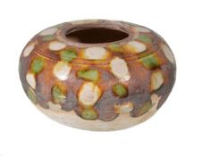 A small Chinese Sancai-glazed water pot, of compressed globular form with recessed mouth, with