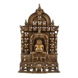 An inscribed copper-alloy 'Jain Tirthankara' shrine, Indian, cast in openwork with the principal