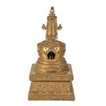 Y A Sino-Tibetan gilt-bronze Stupa, of bell-shaped form on raised square pedestal