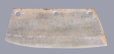A large Chinese archaistic ceremonial jade or stone blade, with a long upper edge along its length