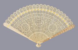 Y A Chinese ivory brise fan, Canton, first quarter of the 19th century, carved on one side