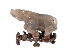 A large Chinese agate carving of a water buffalo, Qing Dynasty, standing with head raised, with