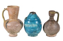 Five Persian pottery vessels, circa 10-13th century, comprising: two cobalt splashed, a turquoise