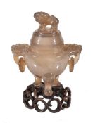 A Chinese archaistic carved agate censer and cover, the compressed globular body rising from three