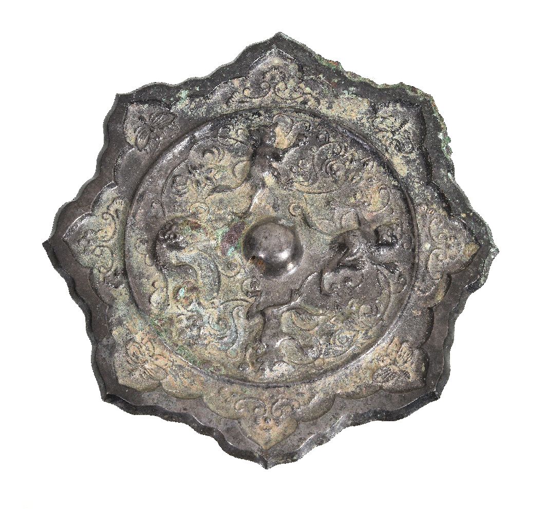 A Chinese bronze octafoil mirror, Tang Dynasty (618-907), of linghua (water chestnut flower) shape