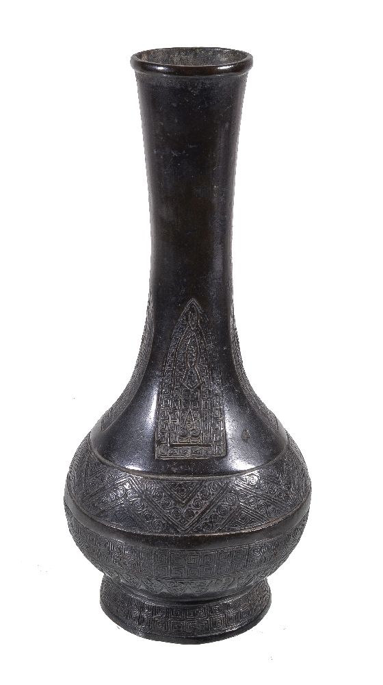 A Chinese bronze archaistic vase, hu, 17th century, the slender flared neck cast with four lappet
