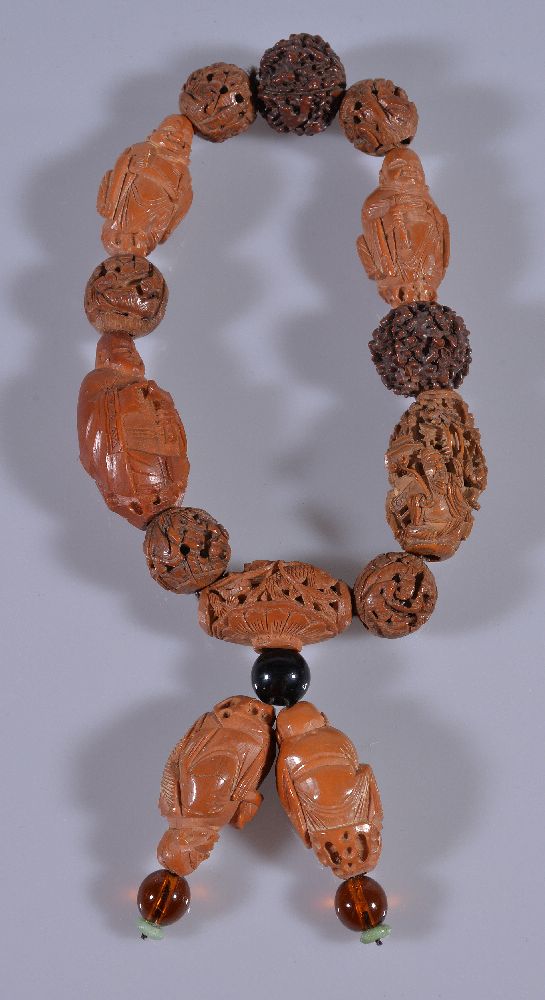 A Chinese carved nut bead necklace and bracelet, with variously carved and plain beads (2) 核雕项链及手串 - Image 3 of 3