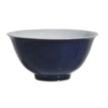 A Chinese blue-glazed bowl, finely potted with deep rounded sides rising from a small, slightly