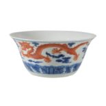 A Chinese blue and white and iron-red 'dragon' bowl, with rounded sides rising to an everted rim,