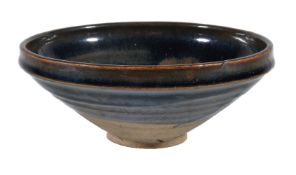A large 'Cizhou' russet-splashed bowl, Jin Dynasty, the robustly potted body with deep gently