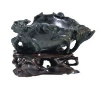 A Chinese Jadeite 'Flower and Frog' brush washer, the flowering branch forming the foot, 11cm long x