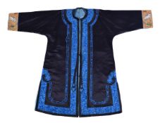 A Chinese lady’s informal robe, Qing Dynasty, 19th century, edged with brilliant blue floral