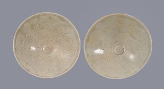 Two Qingbai carved bowls, Southern Song Dynasty, combed and carved with cloud motifs, with pale