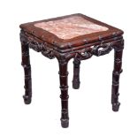 A Chinese Hardwood Stand or Table, the shaped, inset, red marble top supported on an elaborate