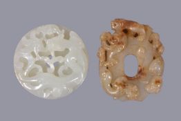 A Chinese white jade 'chilong' disc, bi, carved to the top with a chilong and the underside with