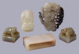 A Chinese white or pale celadon jade carving of Buddha, seated with pierced carved mandorla, 4.5cm