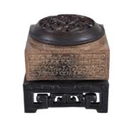 A Chinese archaistic brown and black jade cong, well carved with 'C' scrolls to each side, 5cm x