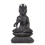 A Chinese bronze Buddha, Ming Dynasty, seated on a double lotus throne, his hands in vitarka and