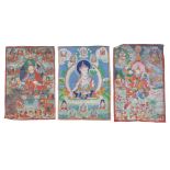 Three Tibetan Thang ka, late 19th century, pigment on cloth, one depicting Padmasambhaba and the