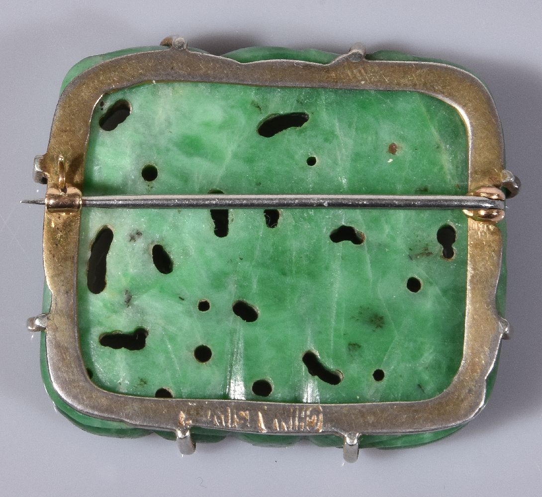 A Chinese green jadeite brooch, the openwork rectangular panel carved with a coiled dragon, jade - Image 2 of 2