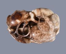 A Chinese agate ‘peach and bat’ carving, of mottled white colour with brown inclusions, with leaf