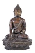 A Tibetan bronze figure of Buddha, seated in padmasana on a lotus throne, his right hand in