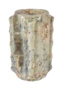A Chinese celadon brown and black flecked jade cong, the tall rectangular body of square section,