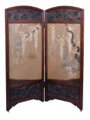 Y A Two-Fold Japanese Screen, the wood frame carved in deep relief with birds amid flowering