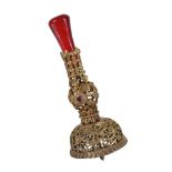 A Chinese gilt metal and red glass hat finial, the gilt-metal joined in four sections on central